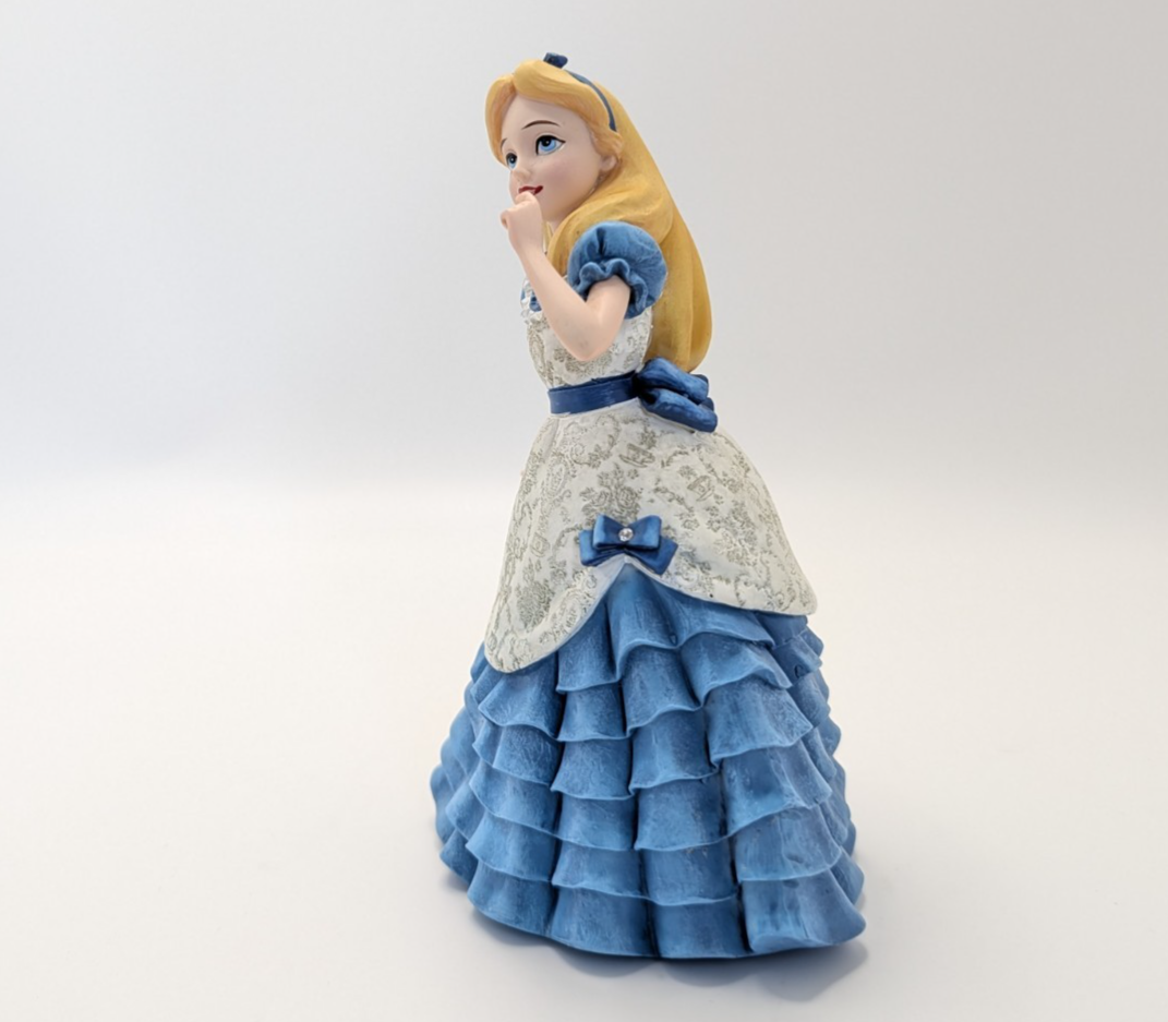 Alternate view of Disney Showcase Alice figurine 6001660 with disclosed fingertip damage