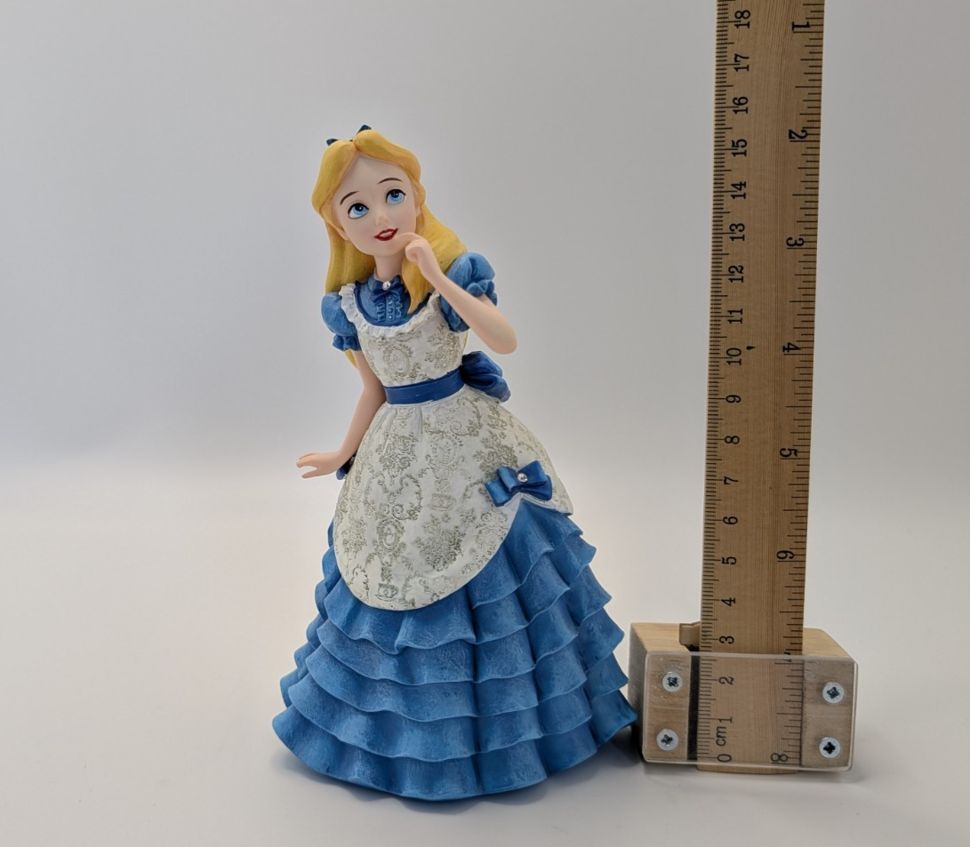 Alternate view of Disney Showcase Alice figurine 6001660 with disclosed fingertip damage