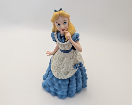 Alternate view of Disney Showcase Alice figurine 6001660 with disclosed fingertip damage