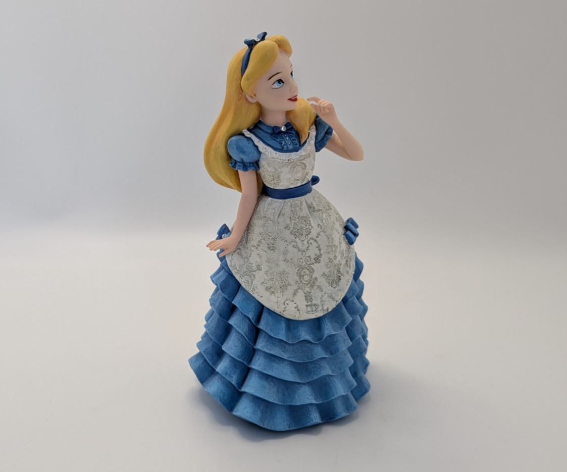 Alternate view of Disney Showcase Alice figurine 6001660 with disclosed fingertip damage