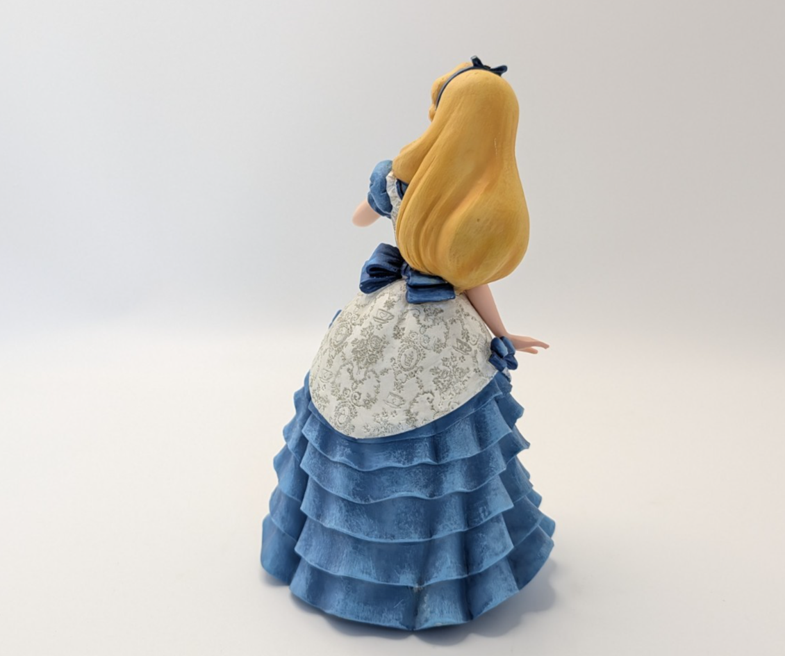 Alternate view of Disney Showcase Alice figurine 6001660 with disclosed fingertip damage