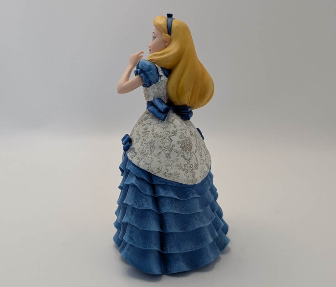 Alternate view of Disney Showcase Alice figurine 6001660 with disclosed fingertip damage