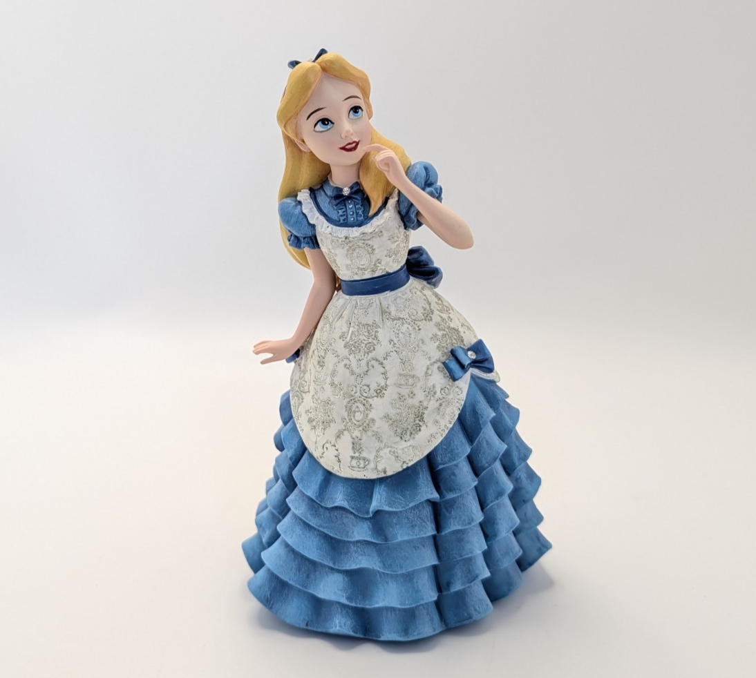 Alternate view of Disney Showcase Alice figurine 6001660 with disclosed fingertip damage