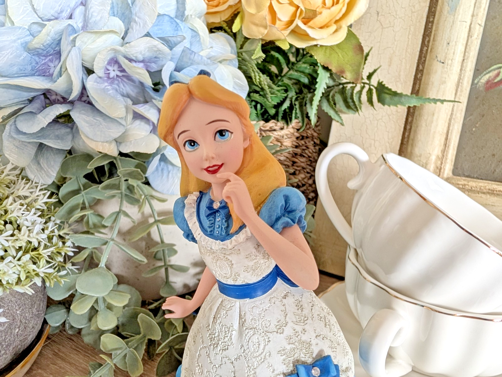 Alternate view of Disney Showcase Alice figurine 6001660 with disclosed fingertip damage