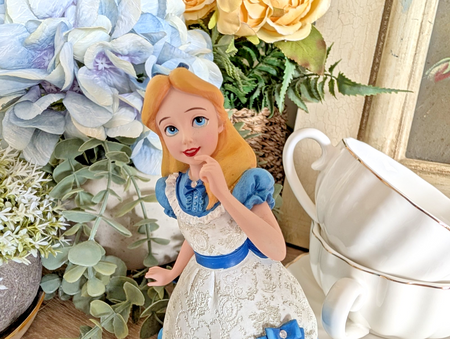 Alternate view of Disney Showcase Alice figurine 6001660 with disclosed fingertip damage