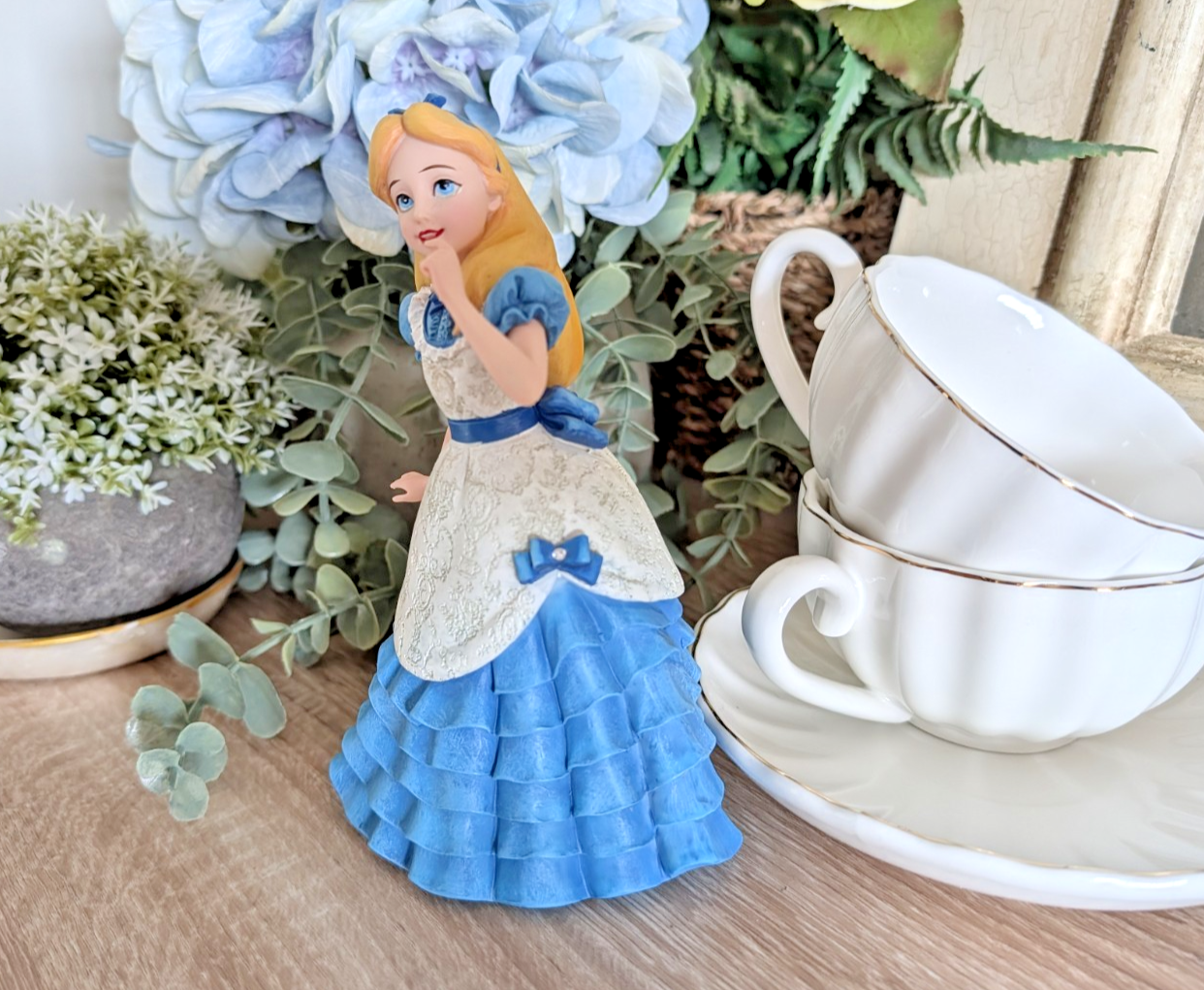 Alternate view of Disney Showcase Alice figurine 6001660 with disclosed fingertip damage