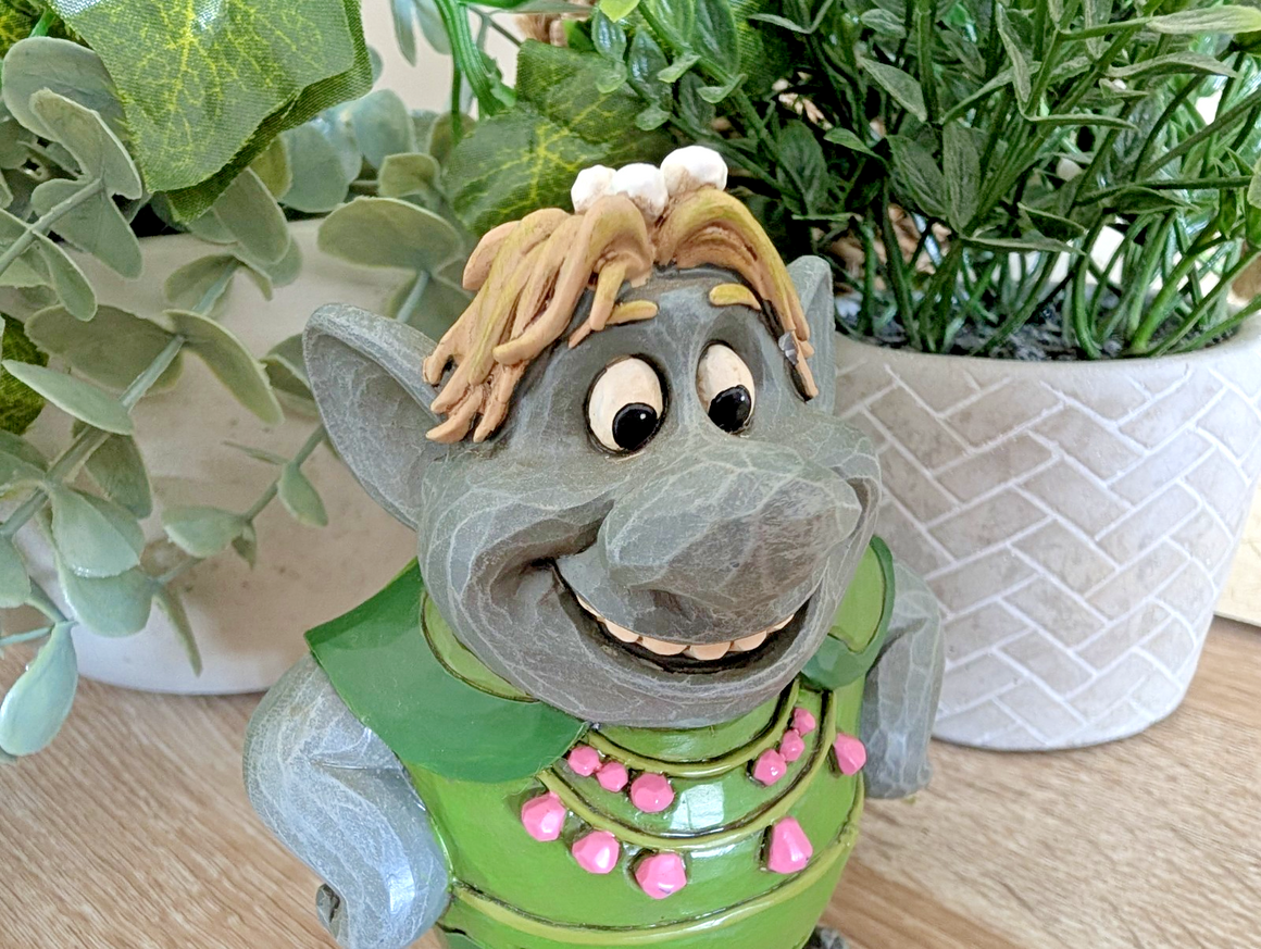 Side view of Bulda Disney Traditions Frozen figurine showing folk-art detail