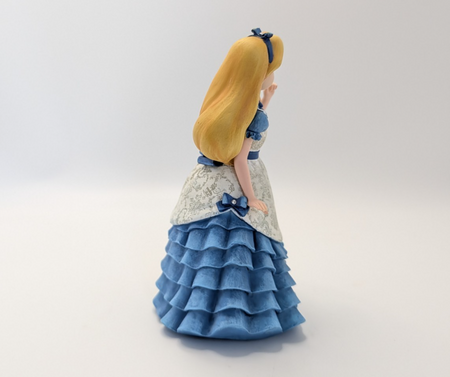 Alternate view of Disney Showcase Alice figurine 6001660 with disclosed fingertip damage